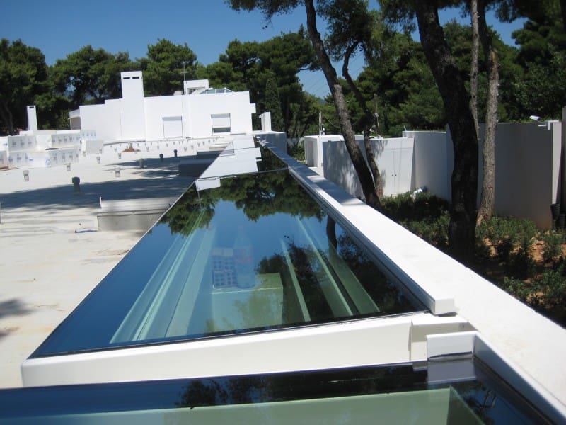 custom sliding and fixed skylights over a swimming pool