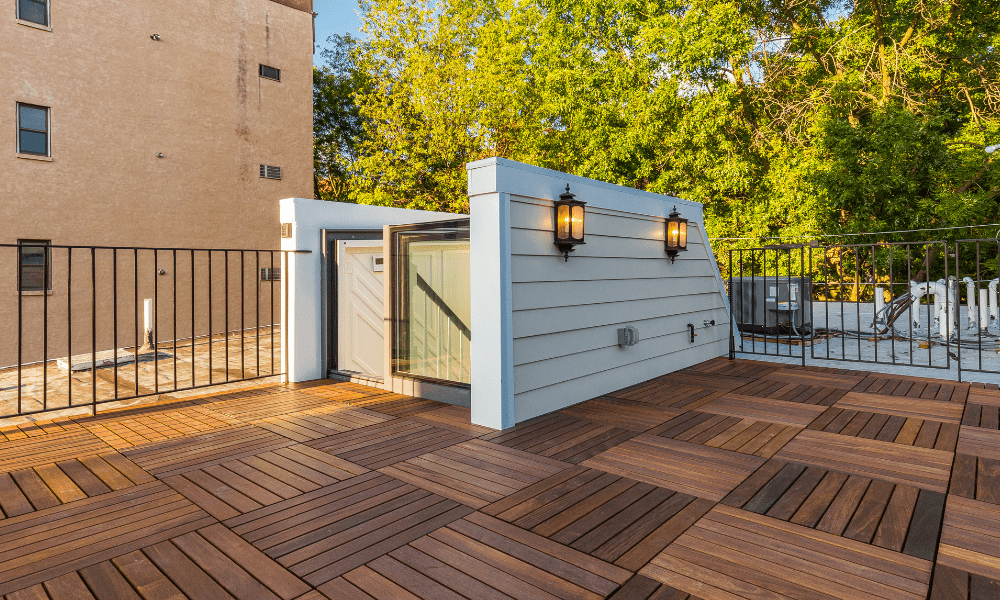 Image of our Skybox on a wooden roof deck for easy access | Skylight Inspiration